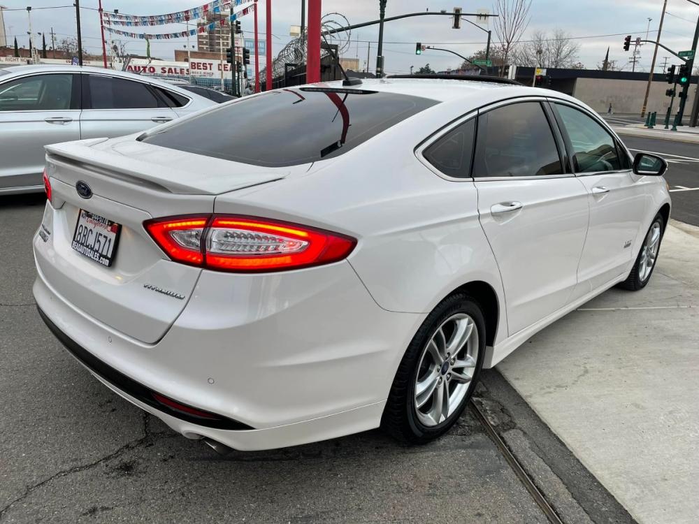 2016 WHITE Ford Fusion Energi Titanium (3FA6P0SUXGR) with an 2.0L L4 DOHC 16V HYBRID engine, Continuously Variable Transmission transmission, located at 744 E Miner Ave, Stockton, CA, 95202, (209) 944-5770, 37.956863, -121.282082 - Photo #7