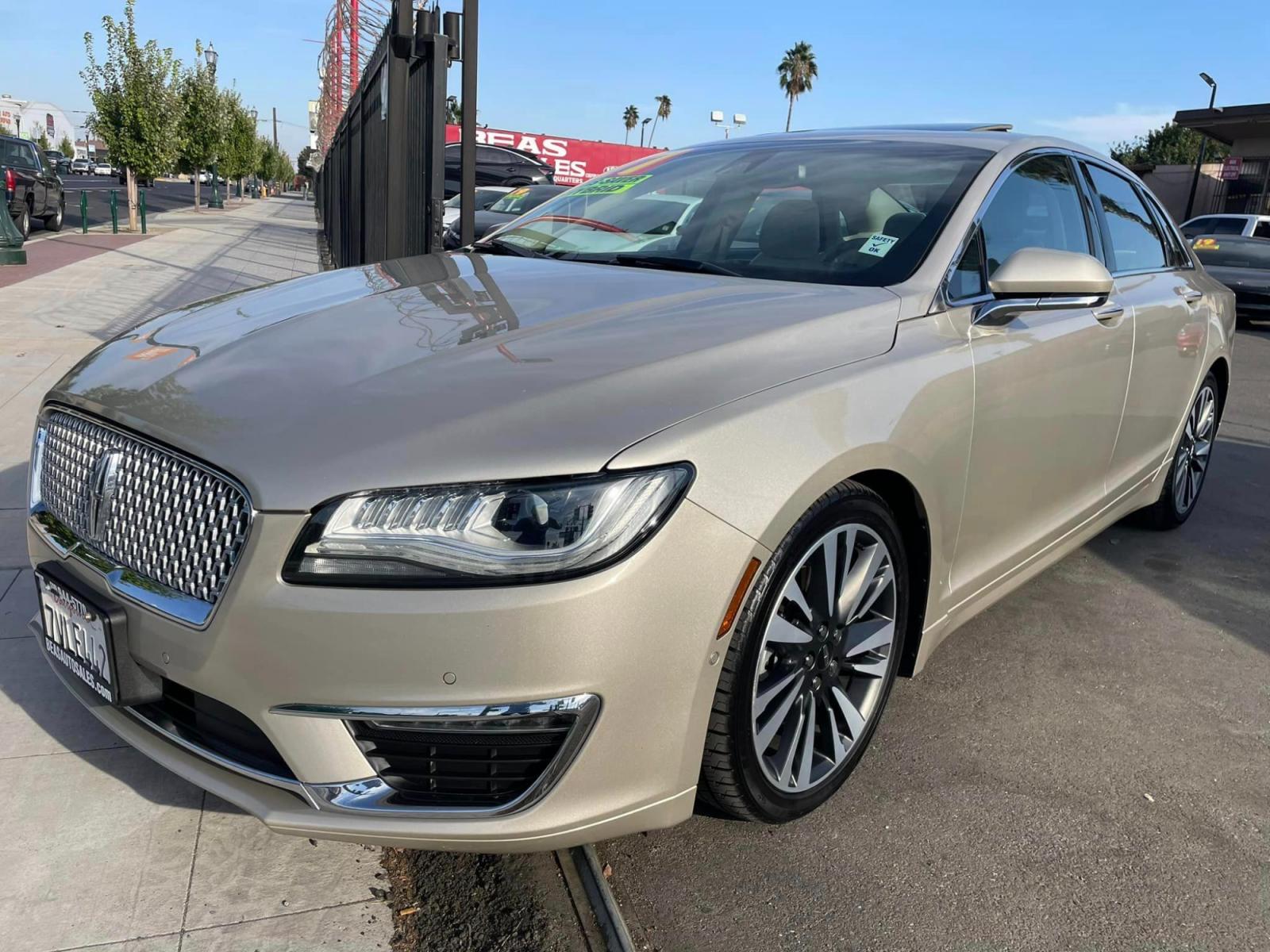 2017 White Gold /White Gold Lincoln MKZ Hybrid Reserve (3LN6L5MUXHR) with an 2.0L L4 DOHC 16V HYBRID engine, CVT transmission, located at 744 E Miner Ave, Stockton, CA, 95202, (209) 944-5770, 37.956863, -121.282082 - Photo #3