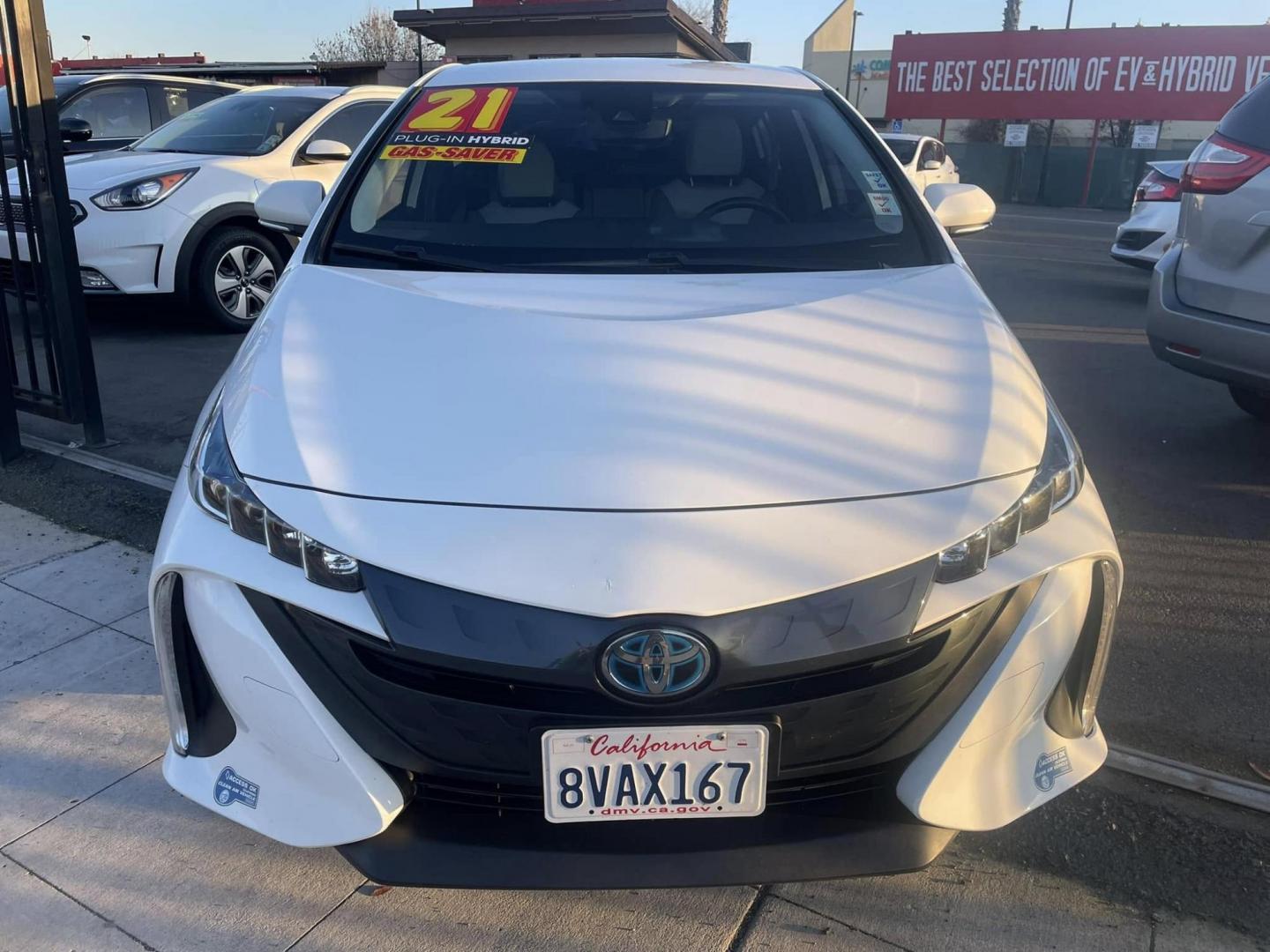 2021 WHITE Toyota Prius Prime LE (JTDKAMFP0M3) with an 1.8L L4 DOHC 16V HYBRID engine, CVT transmission, located at 744 E Miner Ave, Stockton, CA, 95202, (209) 944-5770, 37.956863, -121.282082 - PLUS TAXES AND FEES - Photo#2