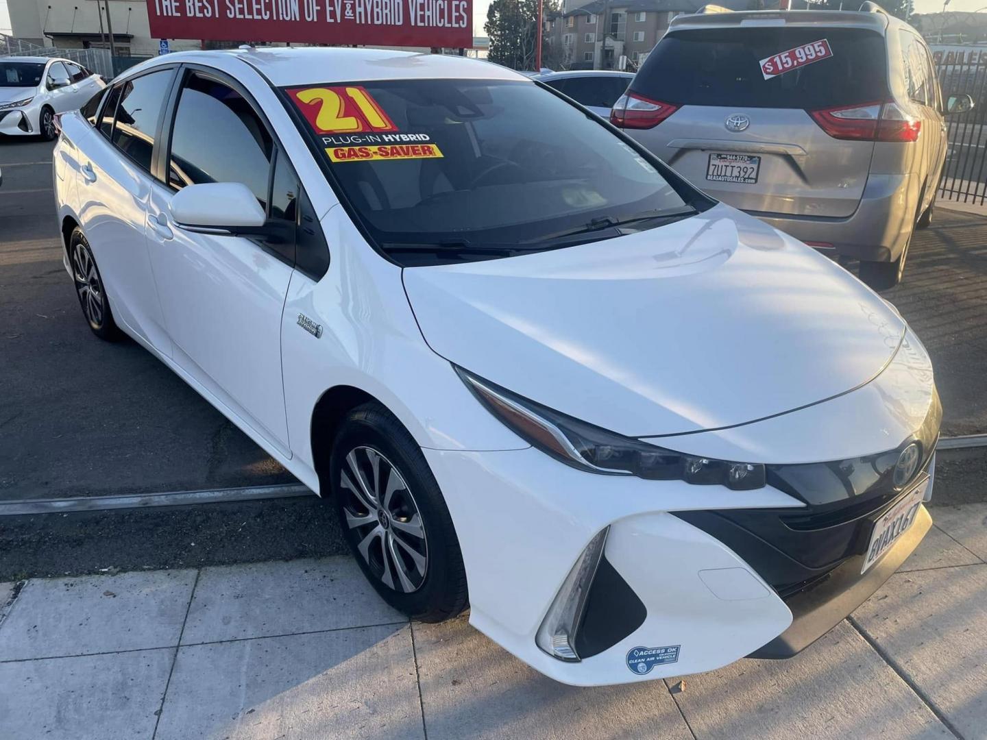 2021 WHITE Toyota Prius Prime LE (JTDKAMFP0M3) with an 1.8L L4 DOHC 16V HYBRID engine, CVT transmission, located at 744 E Miner Ave, Stockton, CA, 95202, (209) 944-5770, 37.956863, -121.282082 - PLUS TAXES AND FEES - Photo#0
