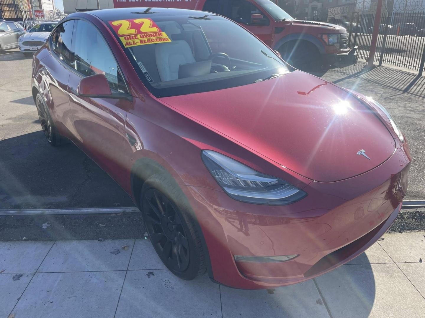 2022 RED Tesla Model Y Long Range (7SAYGDEE1NF) with an ELECTRIC engine, 1A transmission, located at 744 E Miner Ave, Stockton, CA, 95202, (209) 944-5770, 37.956863, -121.282082 - PLUS TAXES AND FEES - Photo#1