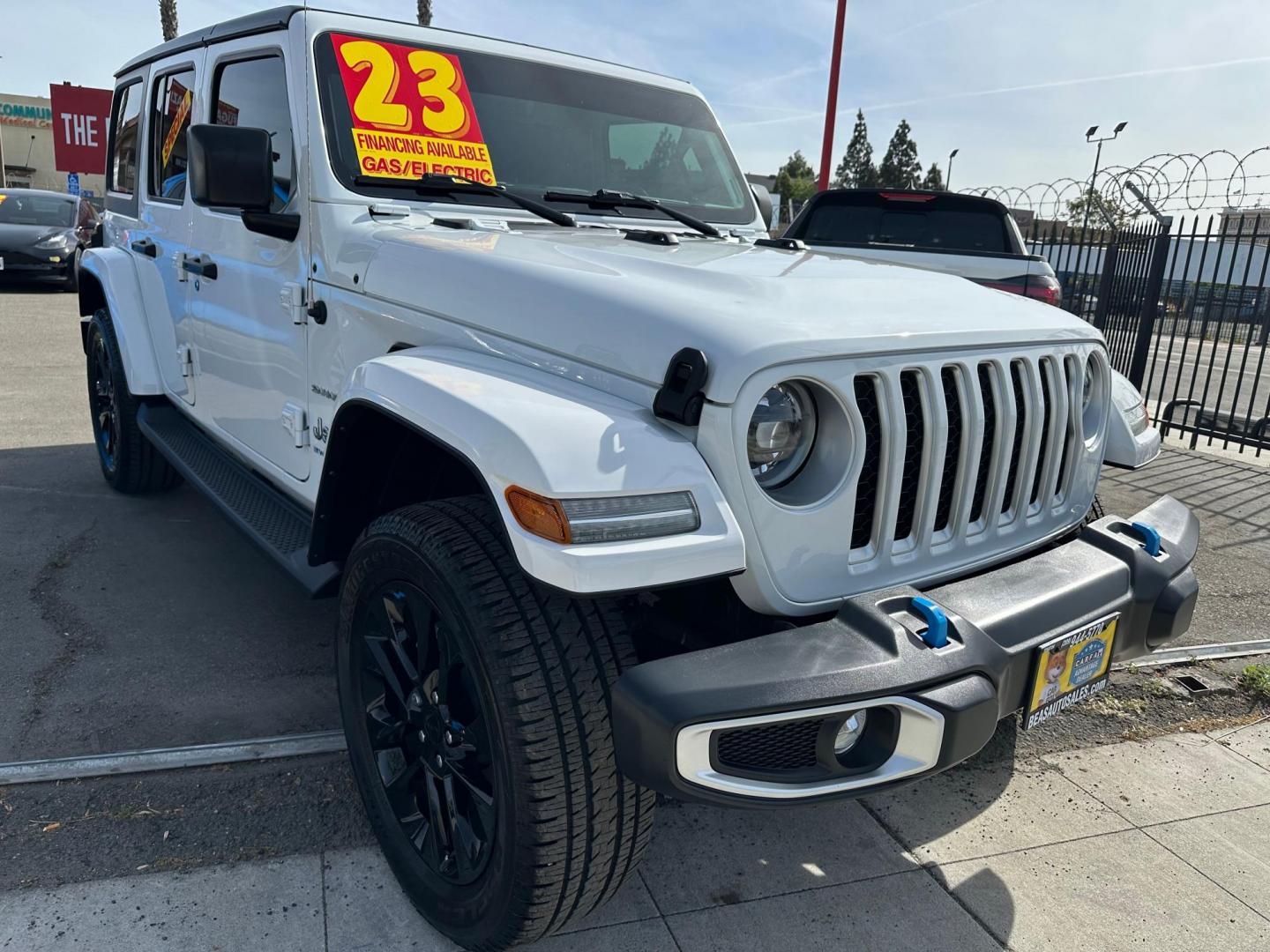 2023 Jeep Wrangler Unlimited Sahara 4XE (1C4JJXP6XPW) with an 2.0L L4 DOHC 16V HYBRID engine, 8A transmission, located at 744 E Miner Ave, Stockton, CA, 95202, (209) 944-5770, 37.956863, -121.282082 - Photo#0