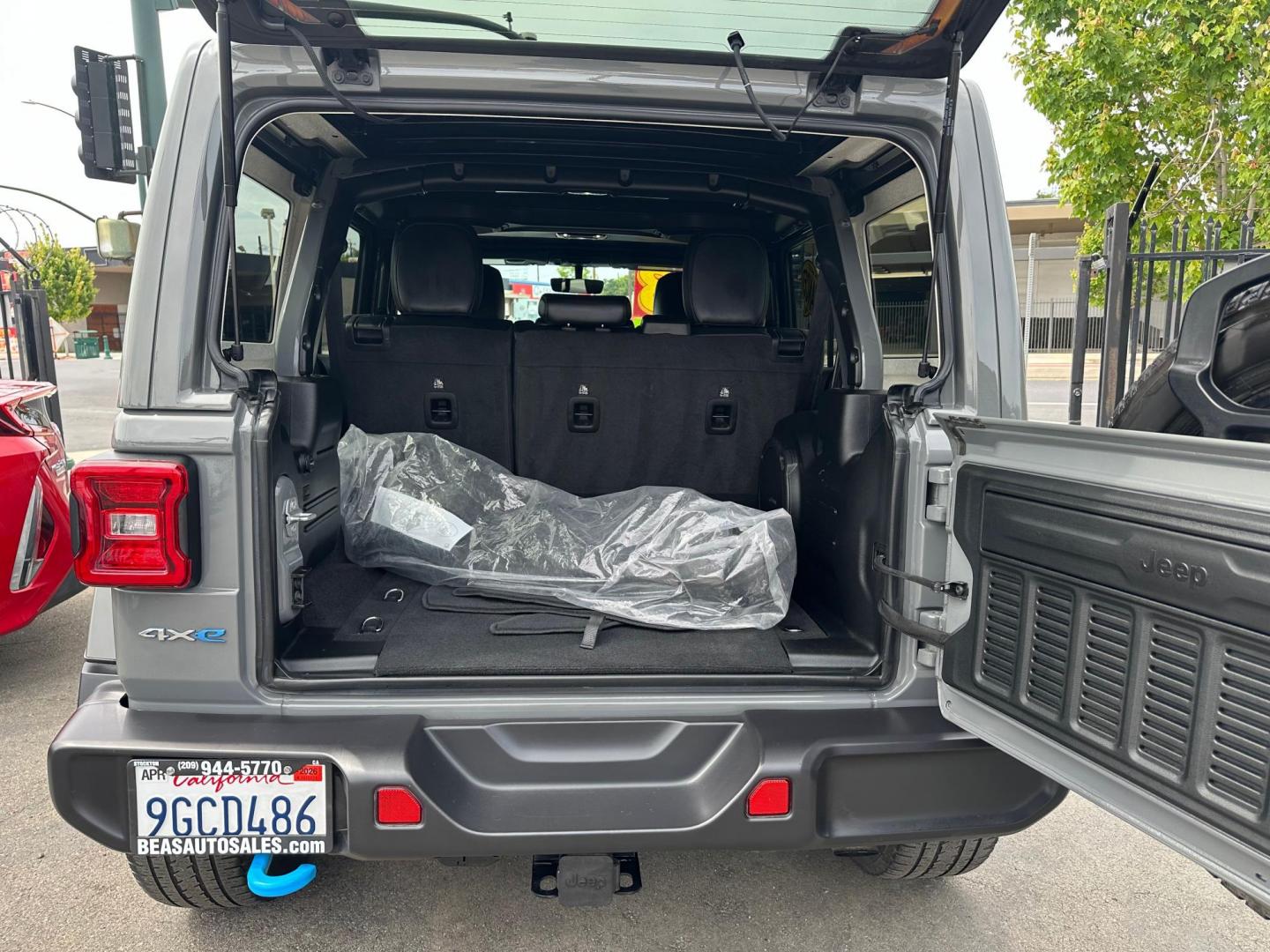 2023 Jeep Wrangler Unlimited Sahara 4XE (1C4JJXP62PW) with an 2.0L L4 DOHC 16V HYBRID engine, 8A transmission, located at 744 E Miner Ave, Stockton, CA, 95202, (209) 944-5770, 37.956863, -121.282082 - Photo#12